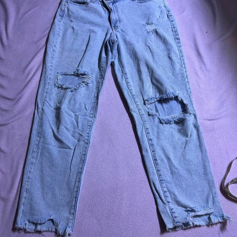 High waisted blue mom jeans with double buttons